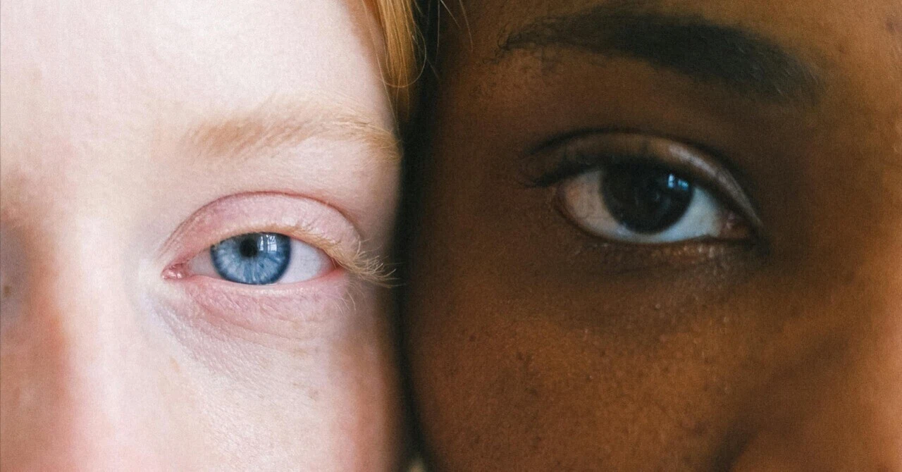 Close-up of two faces, one white and one Black, symbolizing the connection between corporate responsibility and diversity.